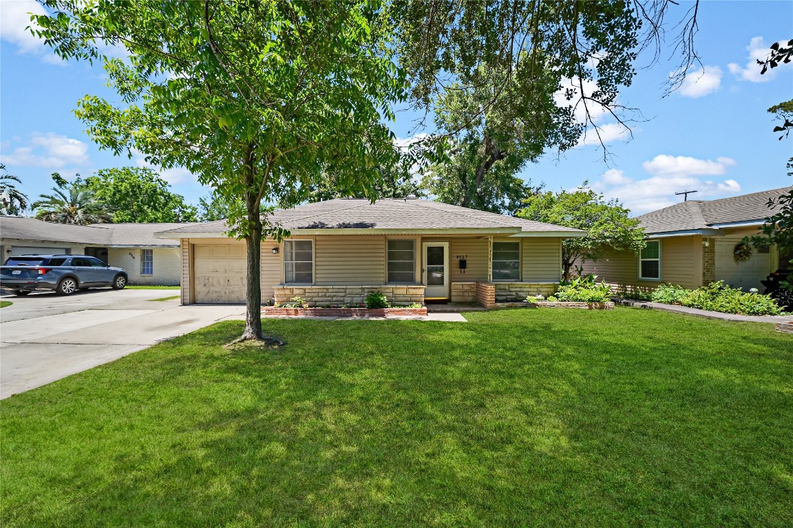 8527 Brower Street Houston, TX 77017 - Photo 2 of 19 a front view of a house with a garden and porch