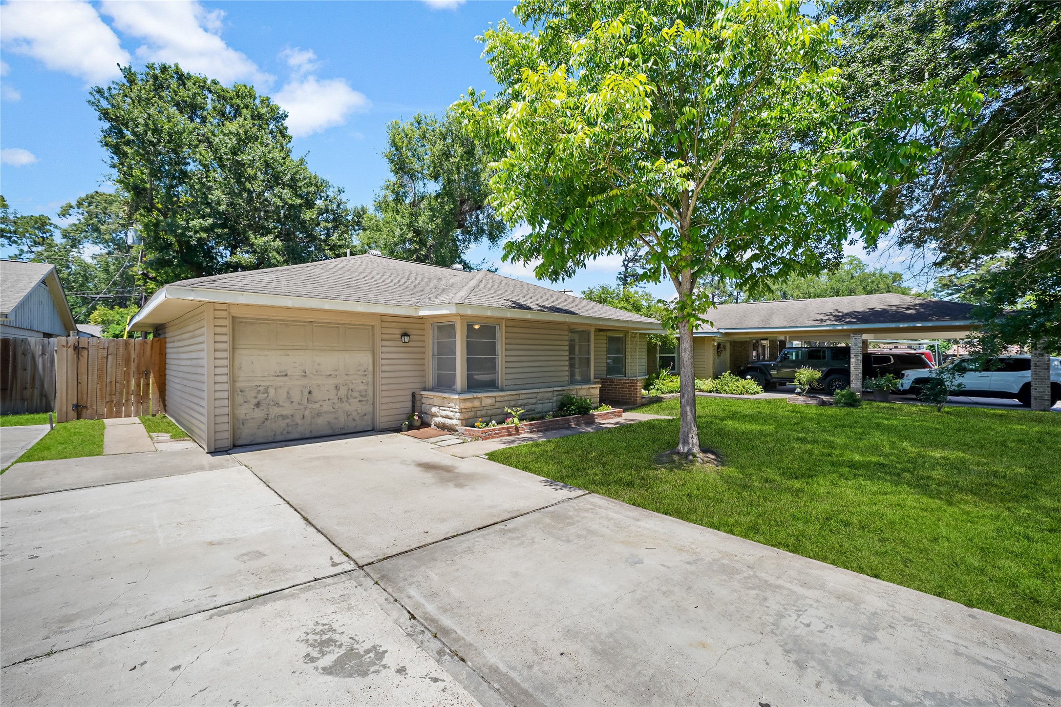 8527 Brower Street Houston, TX 77017 - Photo 3 of 19 a patio with a table and chairs under an umbrella