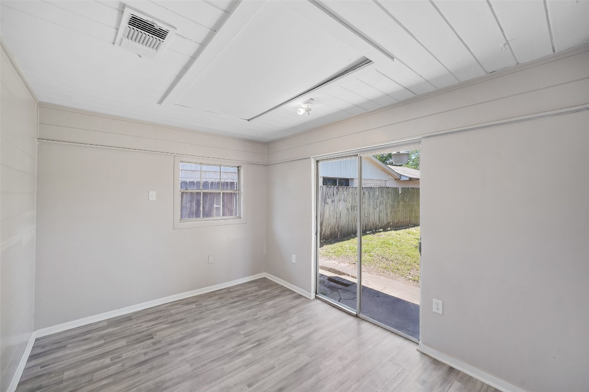 8527 Brower Street Houston, TX 77017 - Photo 7 of 19 a view of an empty room with wooden floor