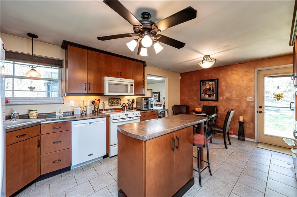 2037 Ridge Road Jeannette, PA 15644 - Photo 10 of 24 a kitchen with cabinets a sink appliances and a window
