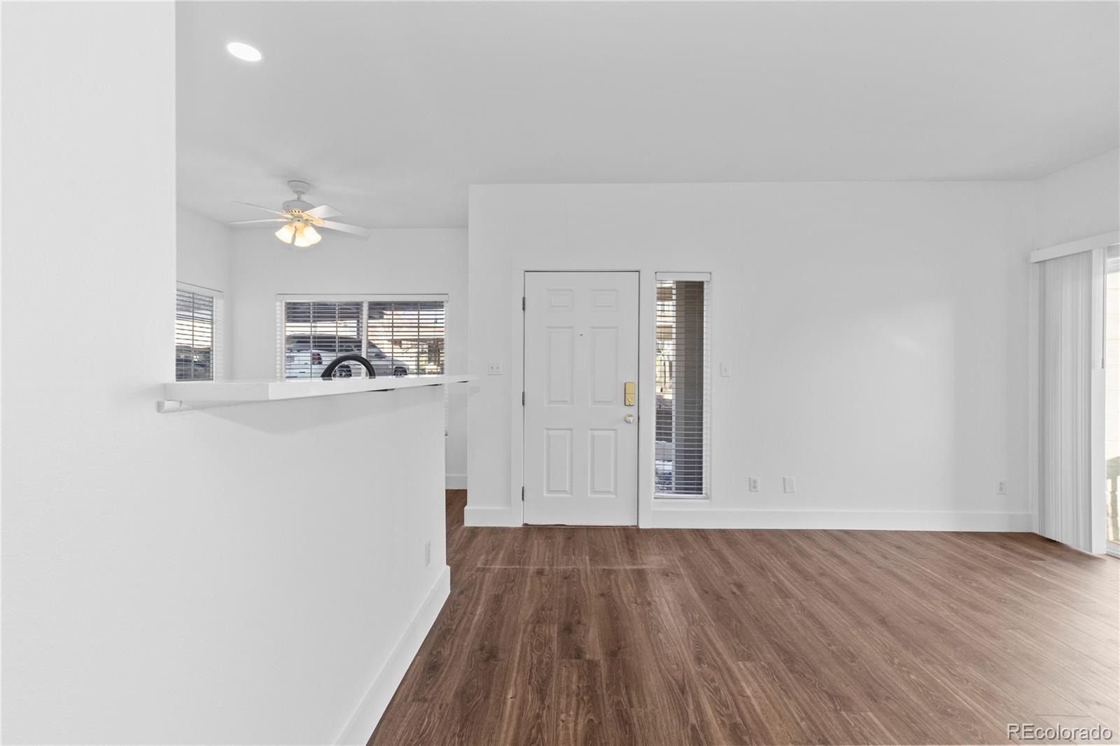 3855 East Canyon Ranch Road, Unit 104 Highlands Ranch, CO 80126 - Photo 19 of 36 a view of empty room with wooden floor
