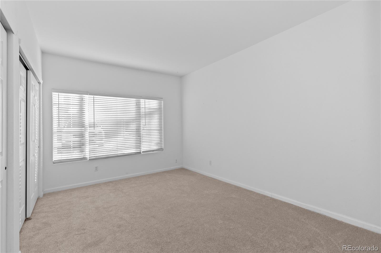 3855 East Canyon Ranch Road, Unit 104 Highlands Ranch, CO 80126 - Photo 20 of 36 an empty room with a window