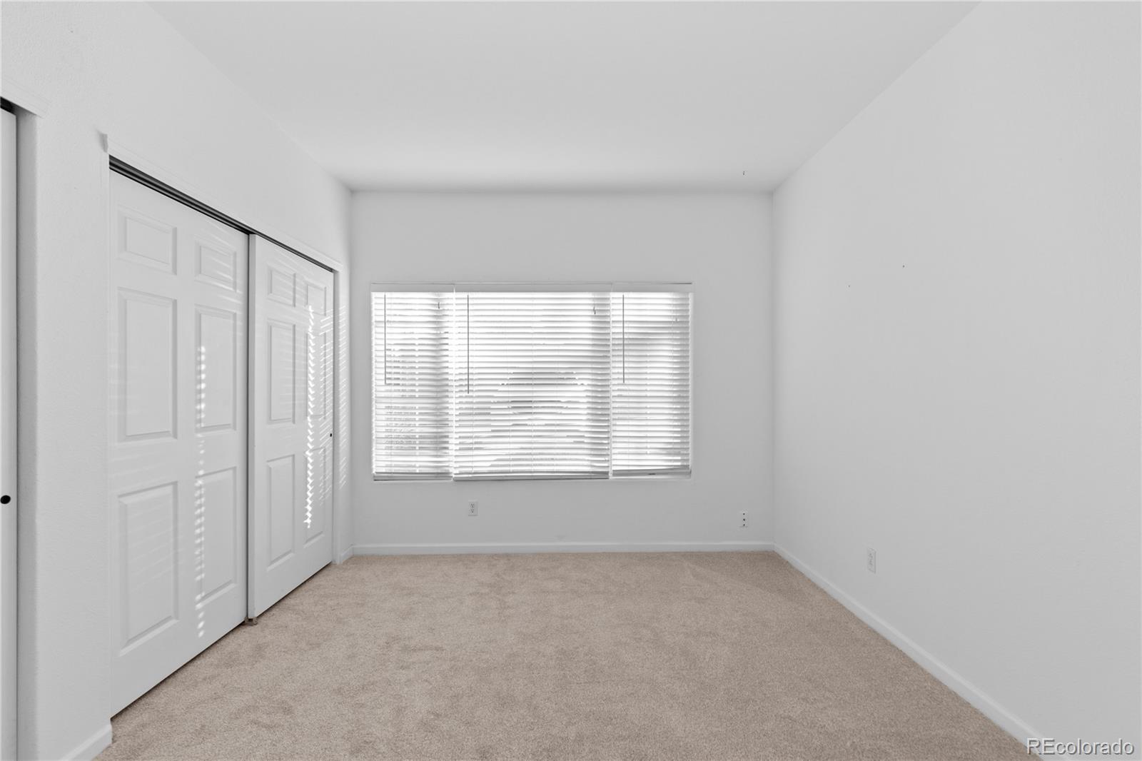 3855 East Canyon Ranch Road, Unit 104 Highlands Ranch, CO 80126 - Photo 21 of 36 an empty room with a window