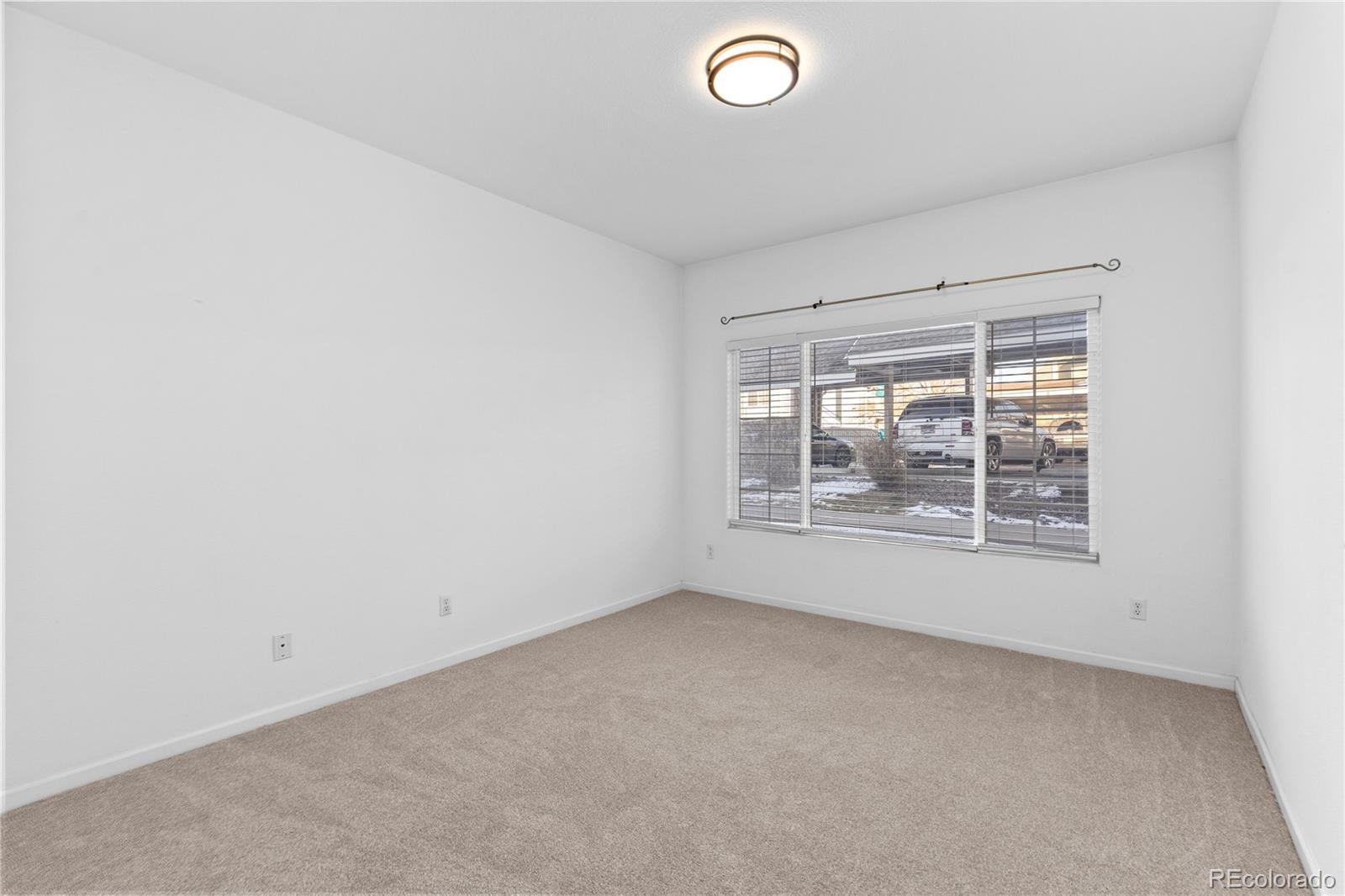 3855 East Canyon Ranch Road, Unit 104 Highlands Ranch, CO 80126 - Photo 27 of 36 an empty room with a window