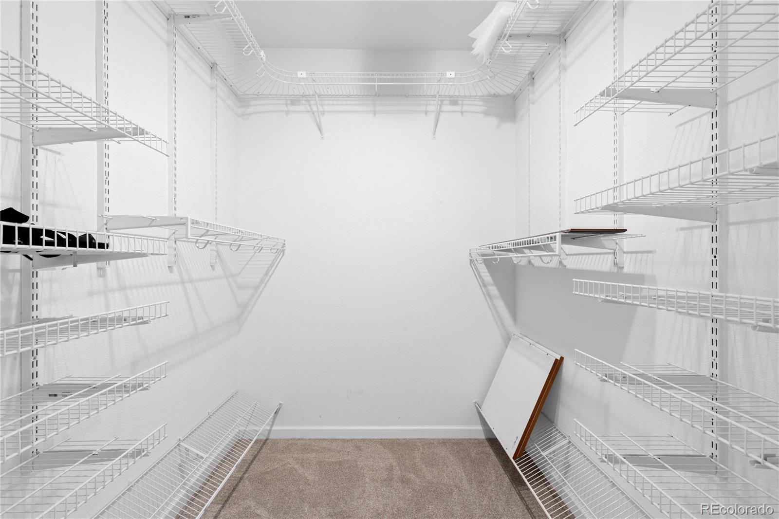 3855 East Canyon Ranch Road, Unit 104 Highlands Ranch, CO 80126 - Photo 29 of 36 a view of a walk in closet