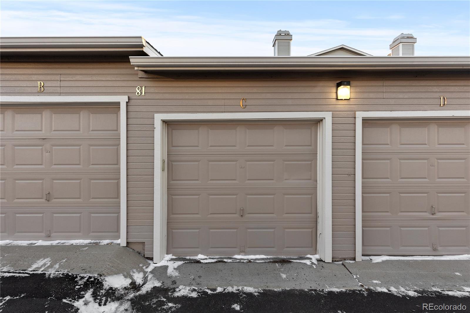 3855 East Canyon Ranch Road, Unit 104 Highlands Ranch, CO 80126 - Photo 35 of 36 a front view of a house with a parking space