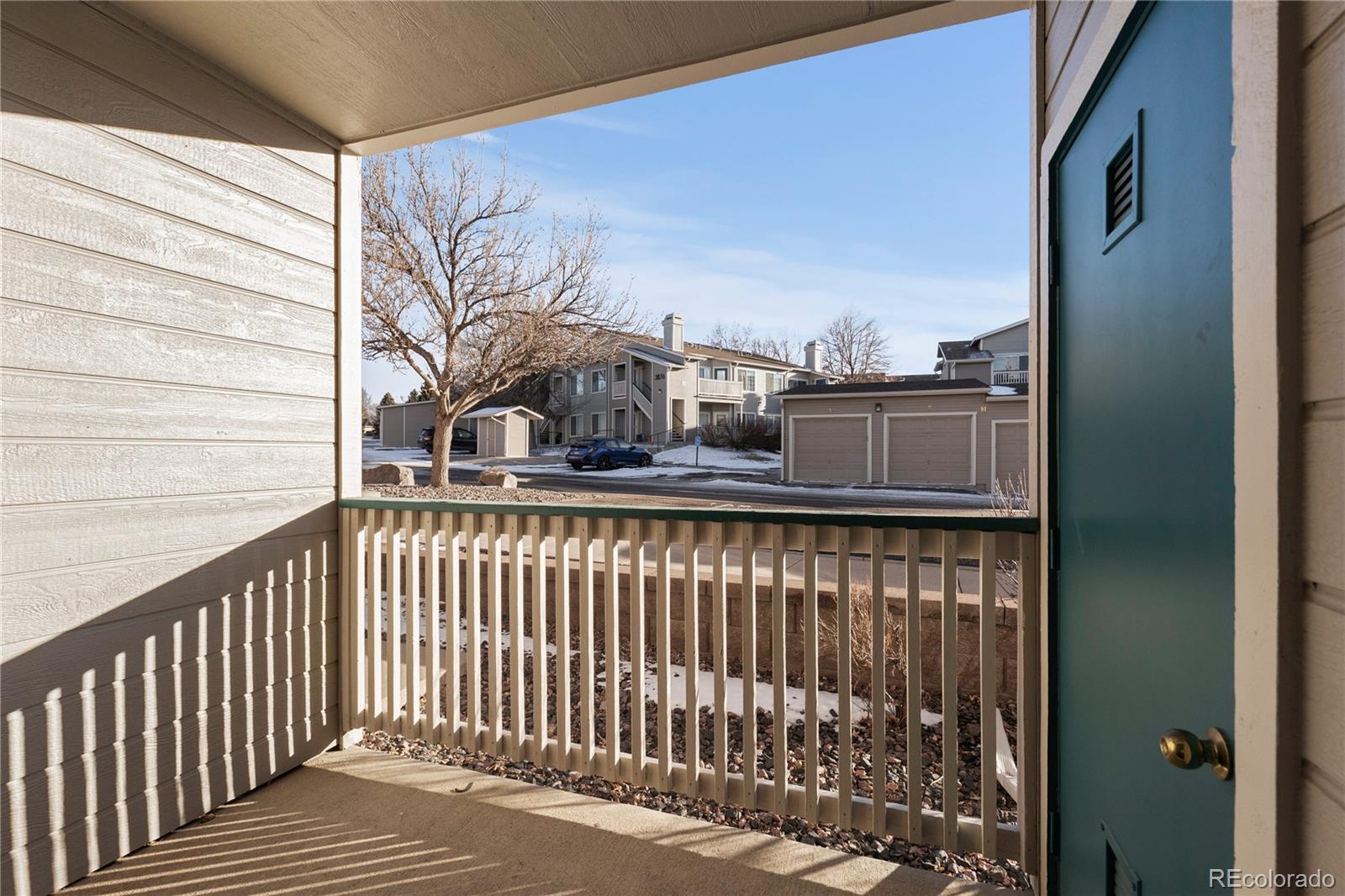 3855 East Canyon Ranch Road, Unit 104 Highlands Ranch, CO 80126 - Photo 7 of 36 a view of a balcony with a door