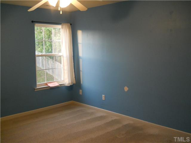 5510 Golden Moss Trail Raleigh, NC 27613 - Photo 13 of 16 Bed Room 2 with walk-in closet, carpet and ceiling fan. Bedroom