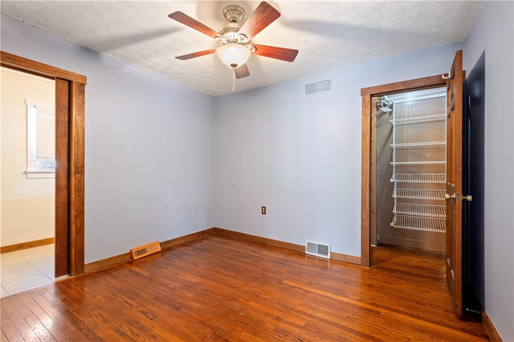232 Naugle Road Beaver Falls, PA 15010 - Photo 12 of 26 Master bedroom with gleaming hardwoods, private bath and walk in closet.