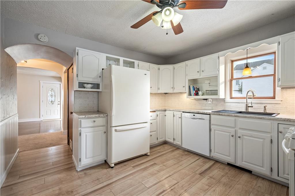 232 Naugle Road Beaver Falls, PA 15010 - Photo 7 of 26 The dining room leads into the updated, bright kitchen.
