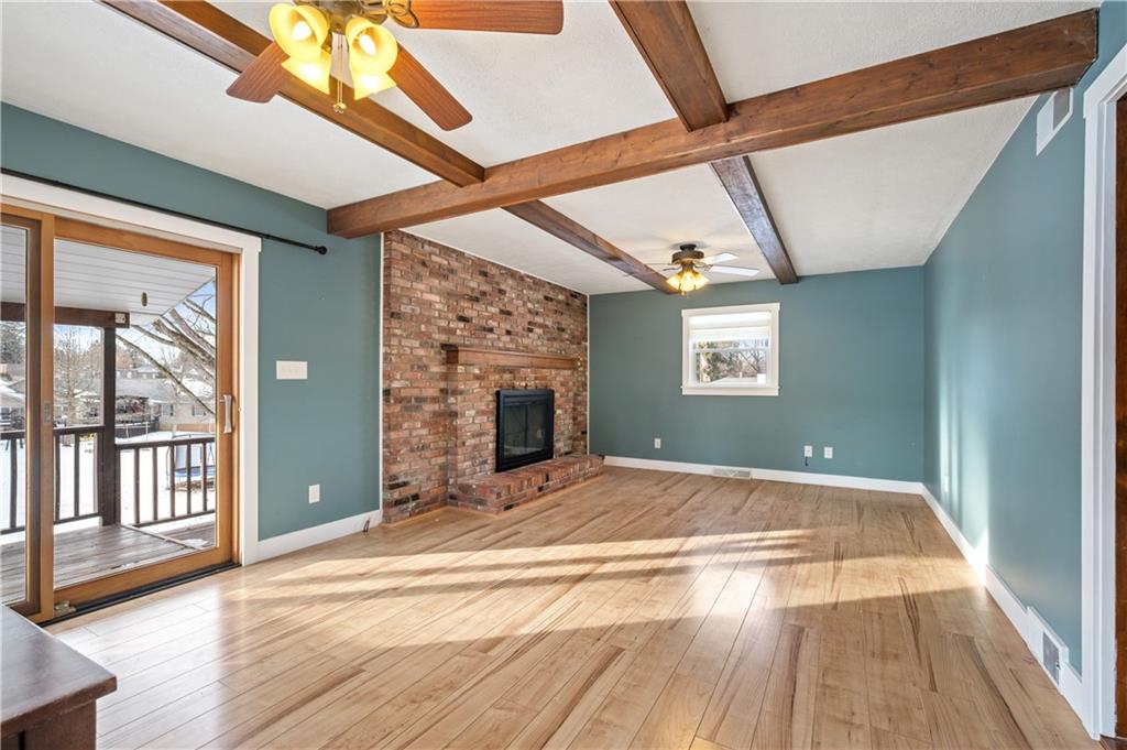 232 Naugle Road Beaver Falls, PA 15010 - Photo 10 of 26 Stunning wood beams and a wood burning fireplace make this family room a space everyone wants to be!
