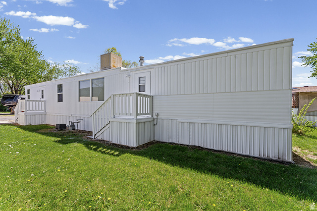24 Grover Street Layton, UT 84041 - Photo 4 of 21 White siding exterior with two entrance decks and stairs