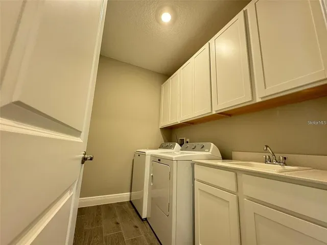 a bathroom with a sink and cabinets