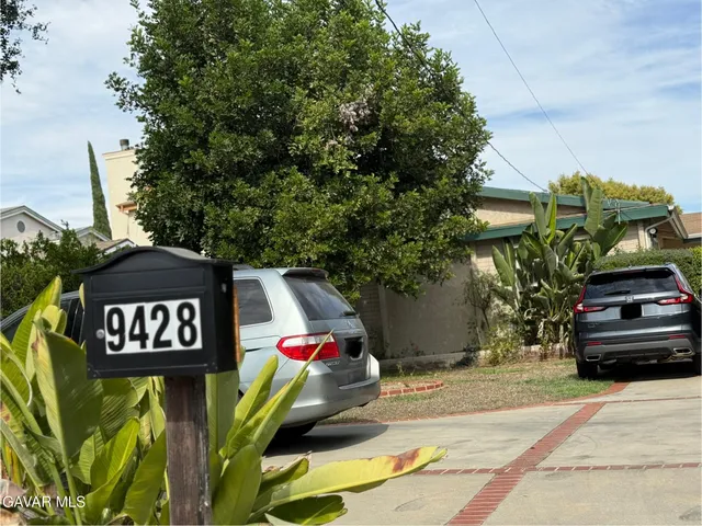 a view of a sign board with street