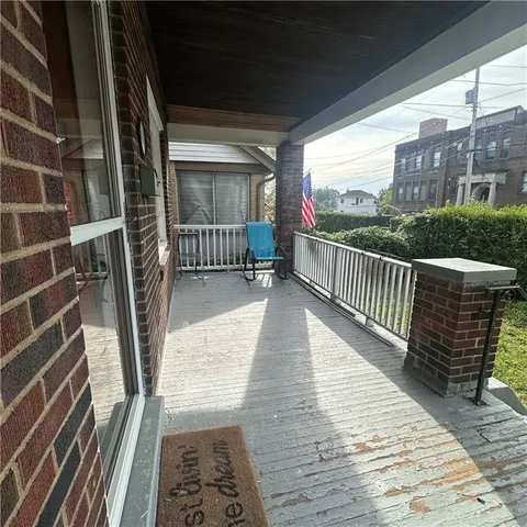 a view of balcony with furniture