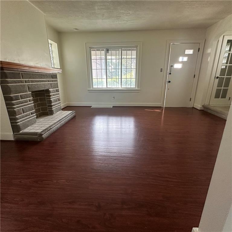 240 Ridgewood Avenue Pittsburgh, PA 15229 - Photo 4 of 14 an empty room with wooden floor and windows