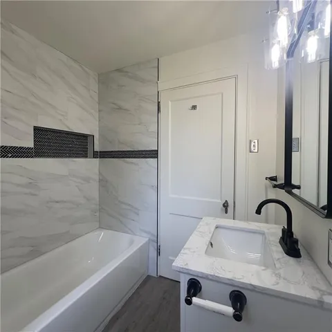 a bathroom with a sink and a bathtub