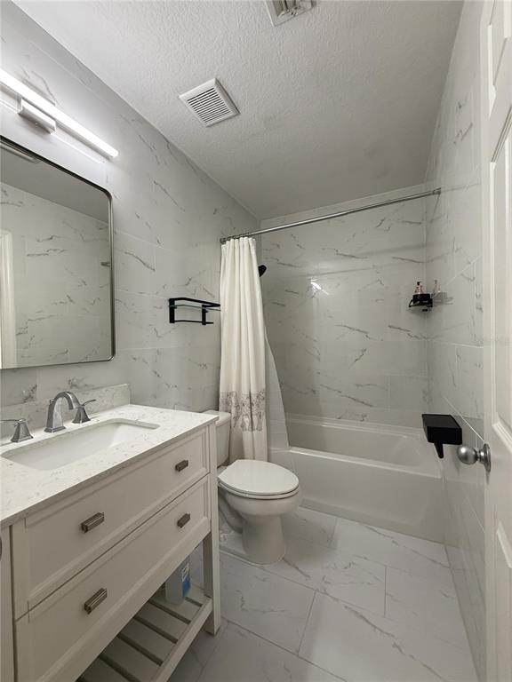 120 South Obrien Street Tampa, FL 33609 - Photo 19 of 47 a bathroom with a granite countertop sink toilet and shower