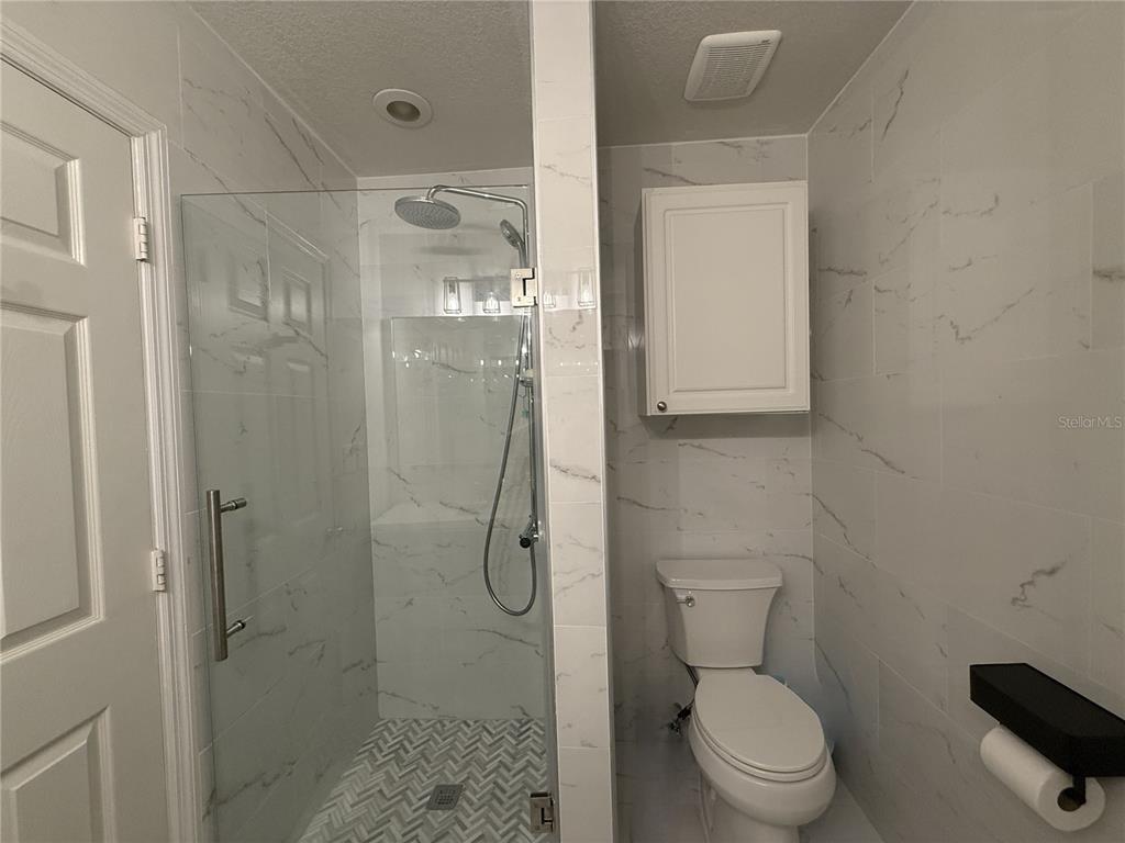 120 South Obrien Street Tampa, FL 33609 - Photo 26 of 47 a bathroom with a toilet and shower