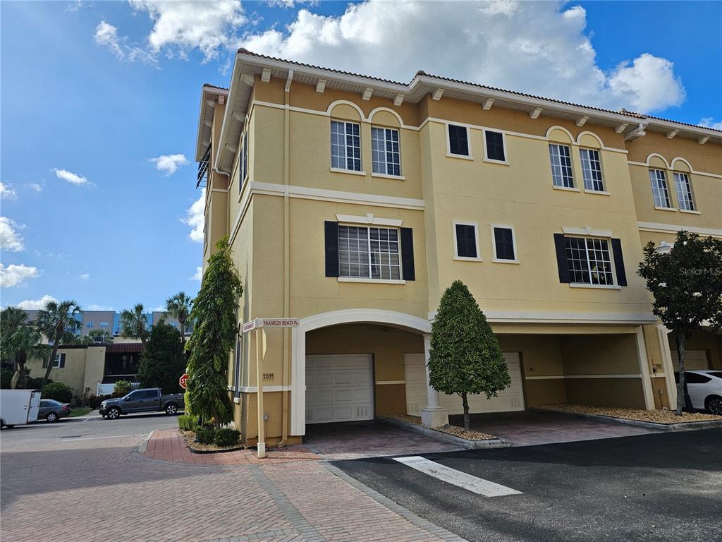 120 South Obrien Street Tampa, FL 33609 - Photo 33 of 47 a front view of a house with a yard and garage