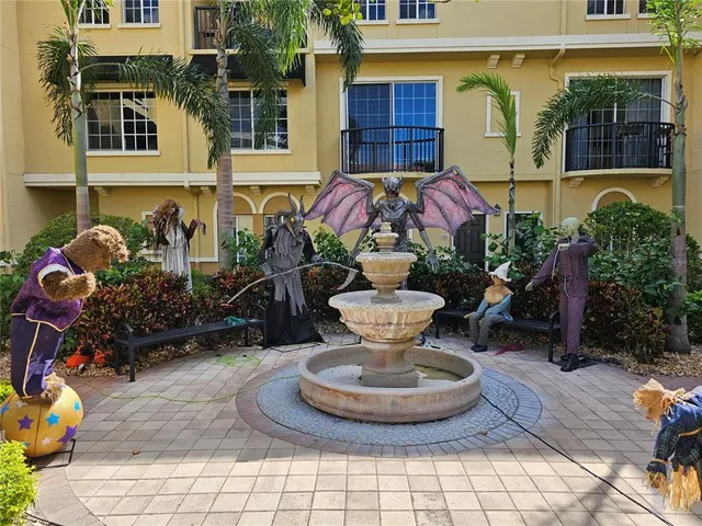 a view of a house with backyard sitting area and swimming pool