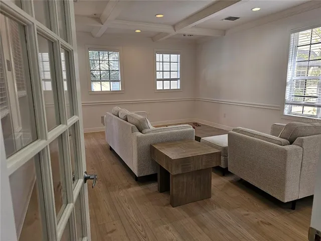 a living room with furniture and a window