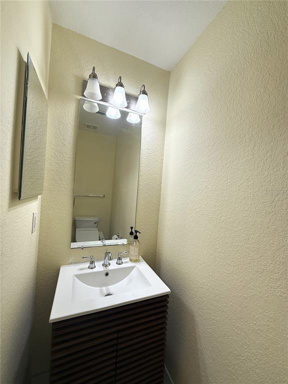 120 South Obrien Street Tampa, FL 33609 - Photo 10 of 47 a bathroom with a sink and a mirror