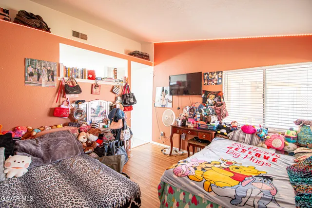 a bed room with furniture and a chandelier