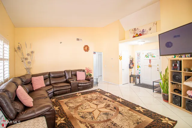 a living room with furniture and a rug
