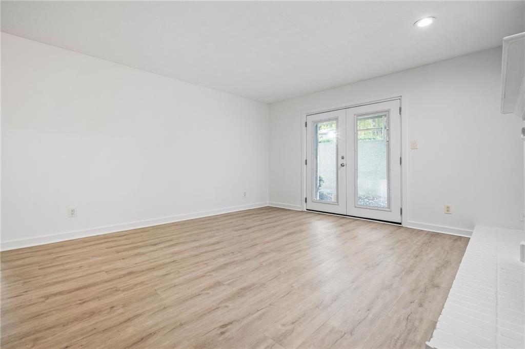 102 River Run Drive Atlanta, GA 30350 - Photo 12 of 28 a view of an empty room and wooden floor