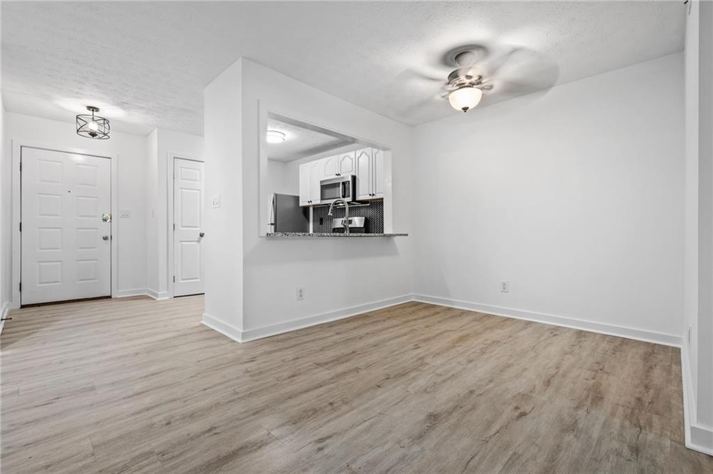 102 River Run Drive Atlanta, GA 30350 - Photo 17 of 28 a view of a livingroom with a kitchen