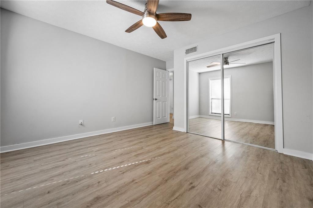 102 River Run Drive Atlanta, GA 30350 - Photo 19 of 28 wooden floor in an empty room