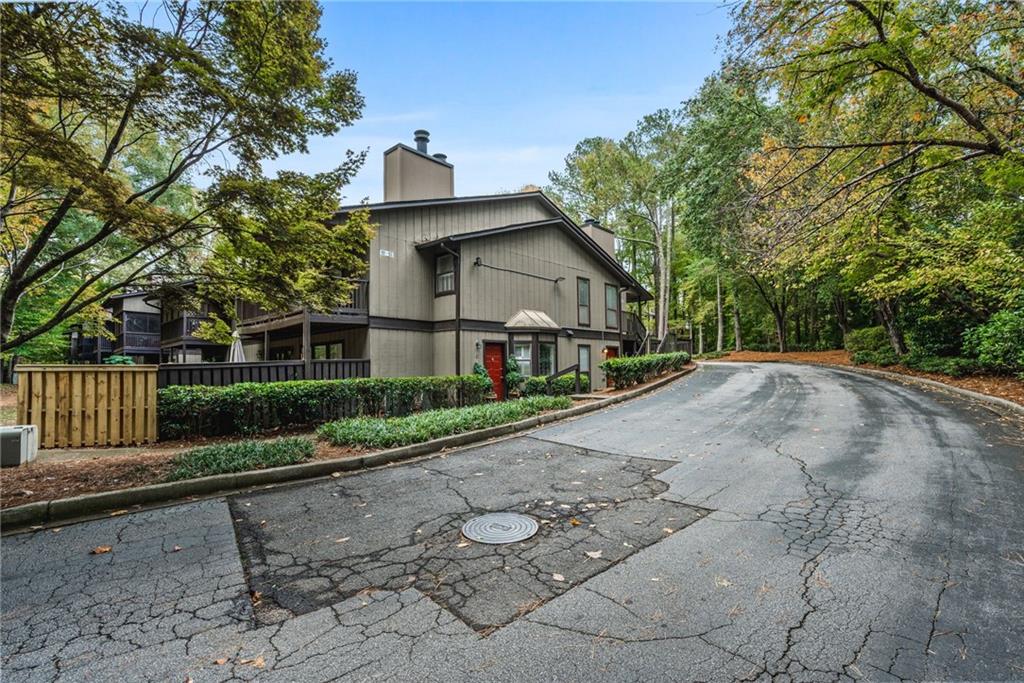 102 River Run Drive Atlanta, GA 30350 - Photo 4 of 28 a view of a house with a yard and large trees