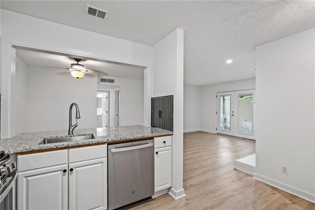 102 River Run Drive Atlanta, GA 30350 - Photo 10 of 28 a bathroom with a granite countertop sink and a mirror