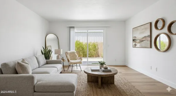 a living room with furniture and a large window