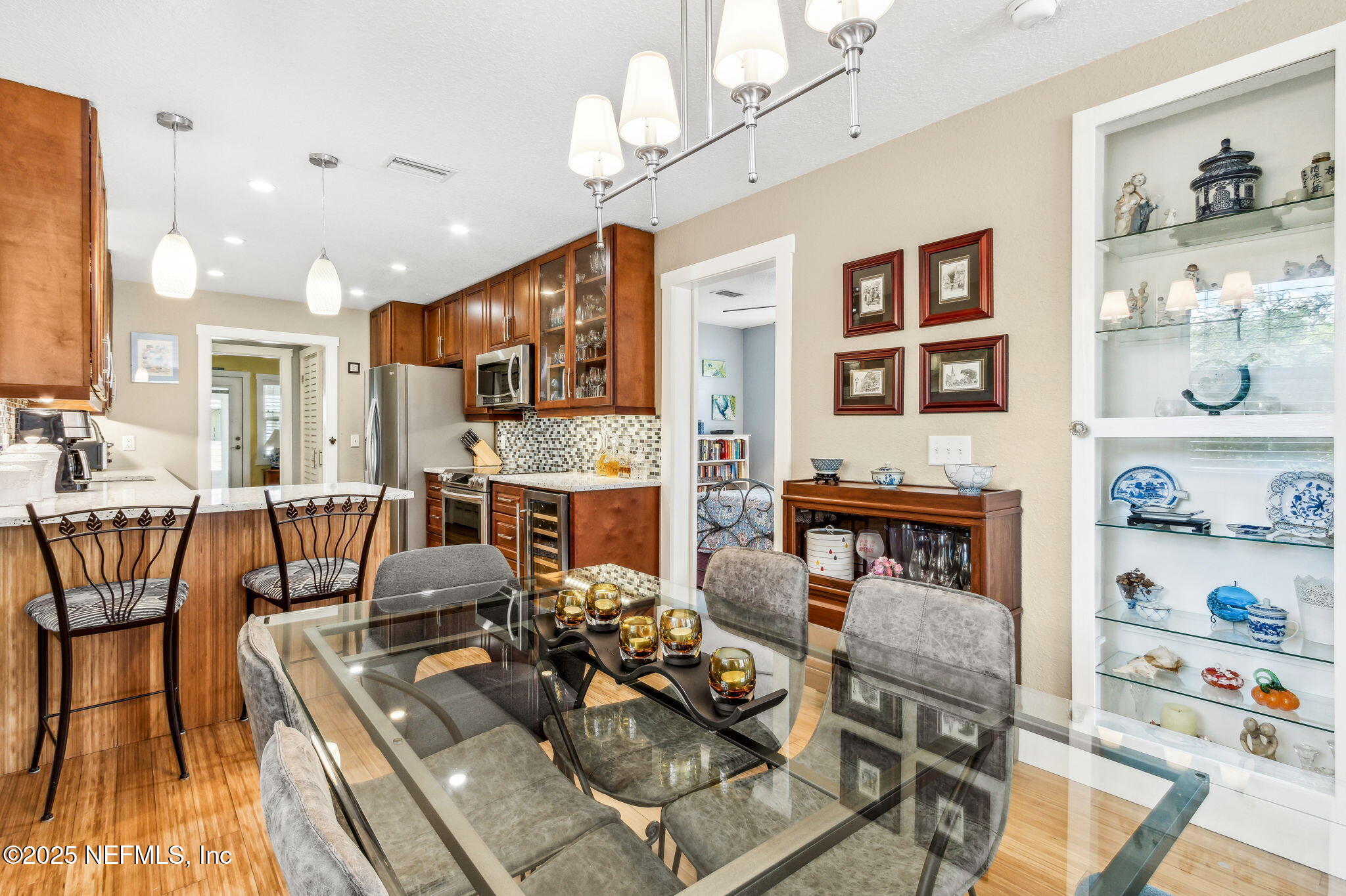 111 South 4th Street Fernandina Beach, FL 32034 - Photo 12 of 37 a living room with fireplace furniture and a kitchen view