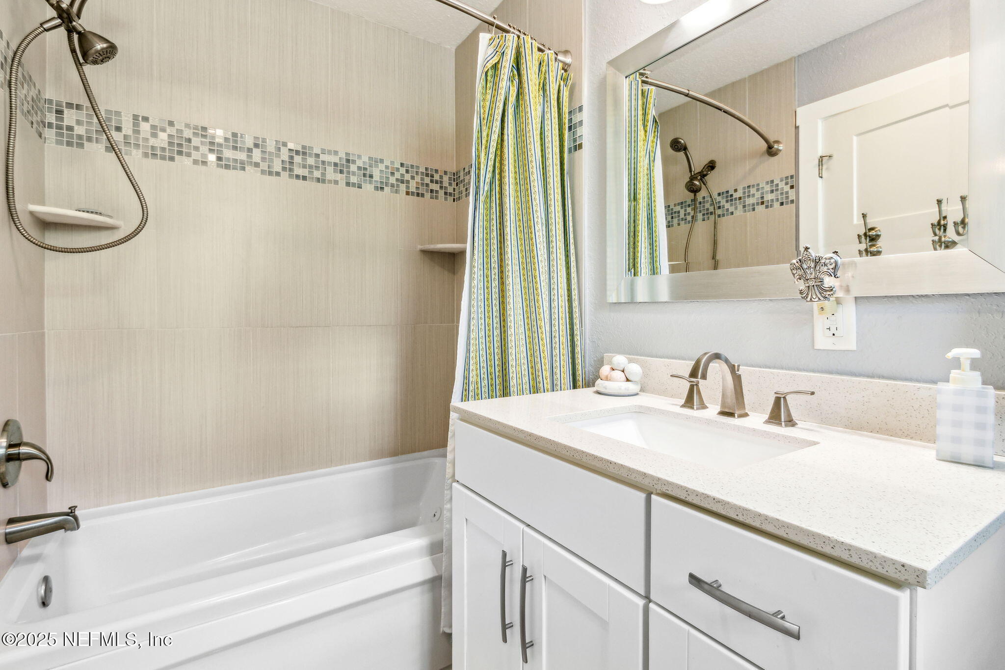 111 South 4th Street Fernandina Beach, FL 32034 - Photo 23 of 37 a bathroom with a sink vanity granite tub shower and a mirror