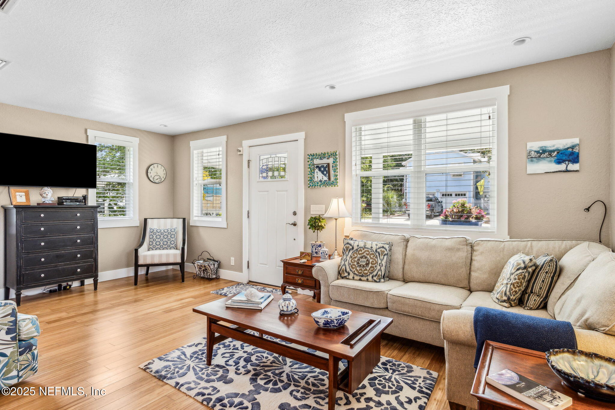 111 South 4th Street Fernandina Beach, FL 32034 - Photo 9 of 37 a living room with furniture and a flat screen tv