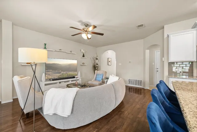 a living room with furniture and a flat screen tv