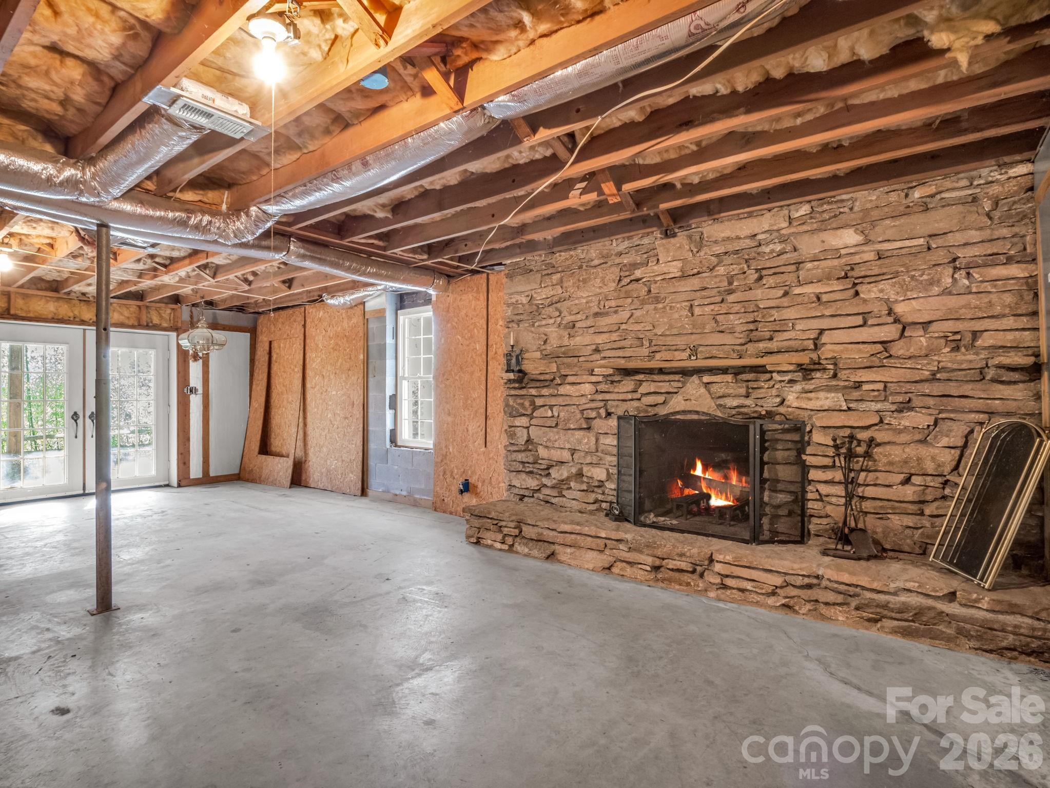 755 Mt Olivet Road Zirconia, NC 28790 - Photo 20 of 35 a view of empty room with fireplace and windows