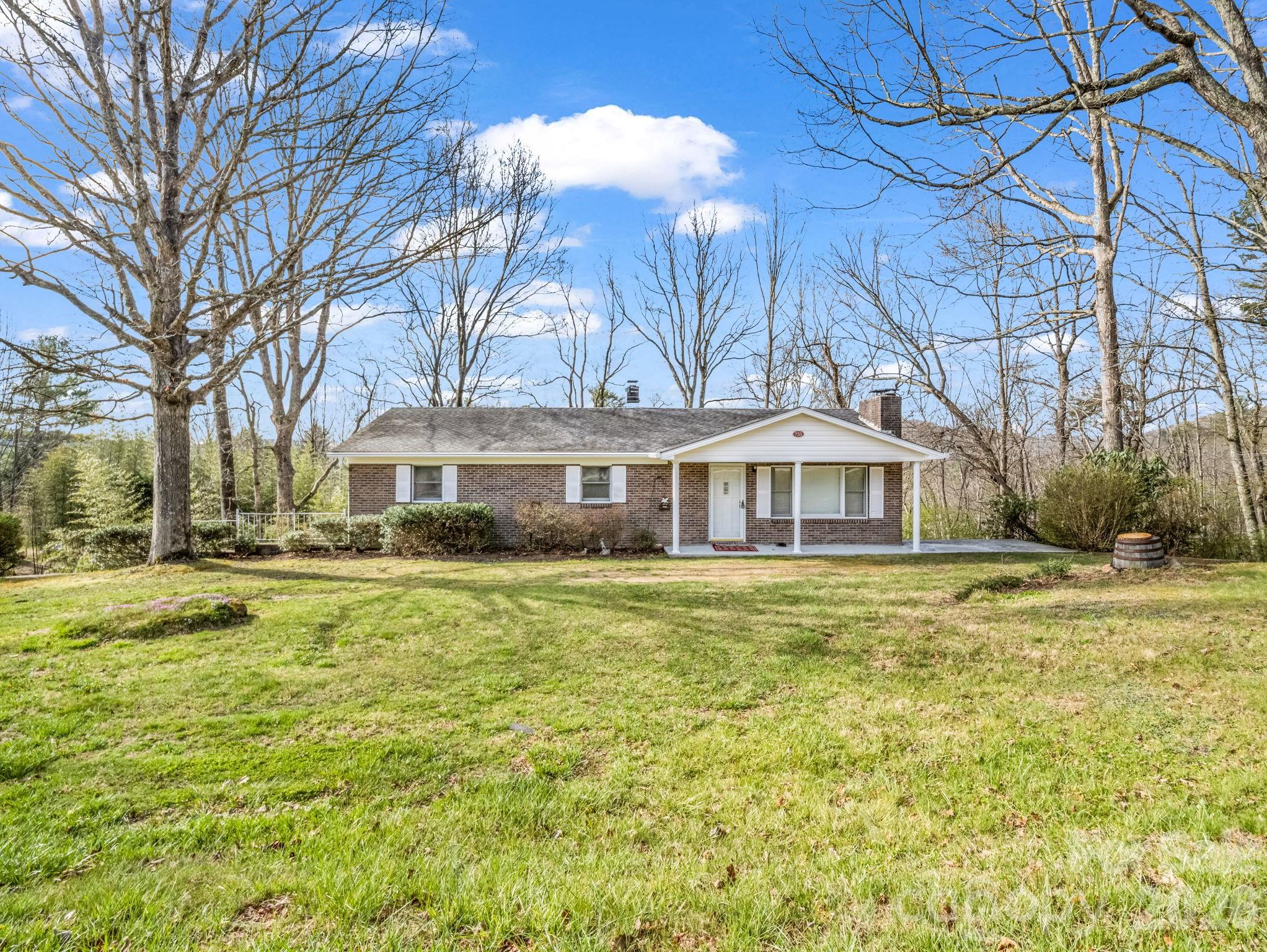 755 Mt Olivet Road Zirconia, NC 28790 - Photo 2 of 35 a front view of a house with a yard