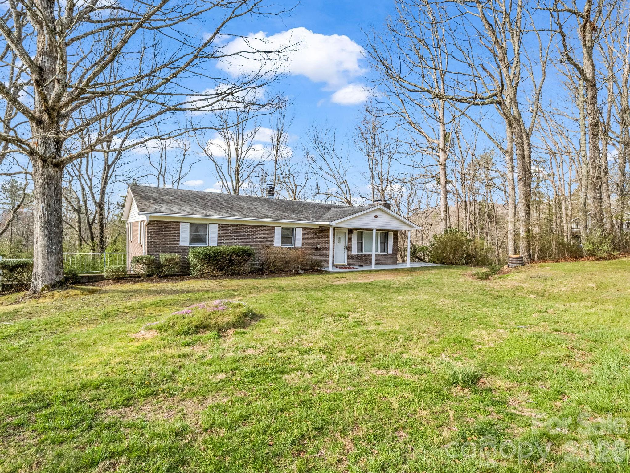 755 Mt Olivet Road Zirconia, NC 28790 - Photo 34 of 35 a front view of a house with a garden