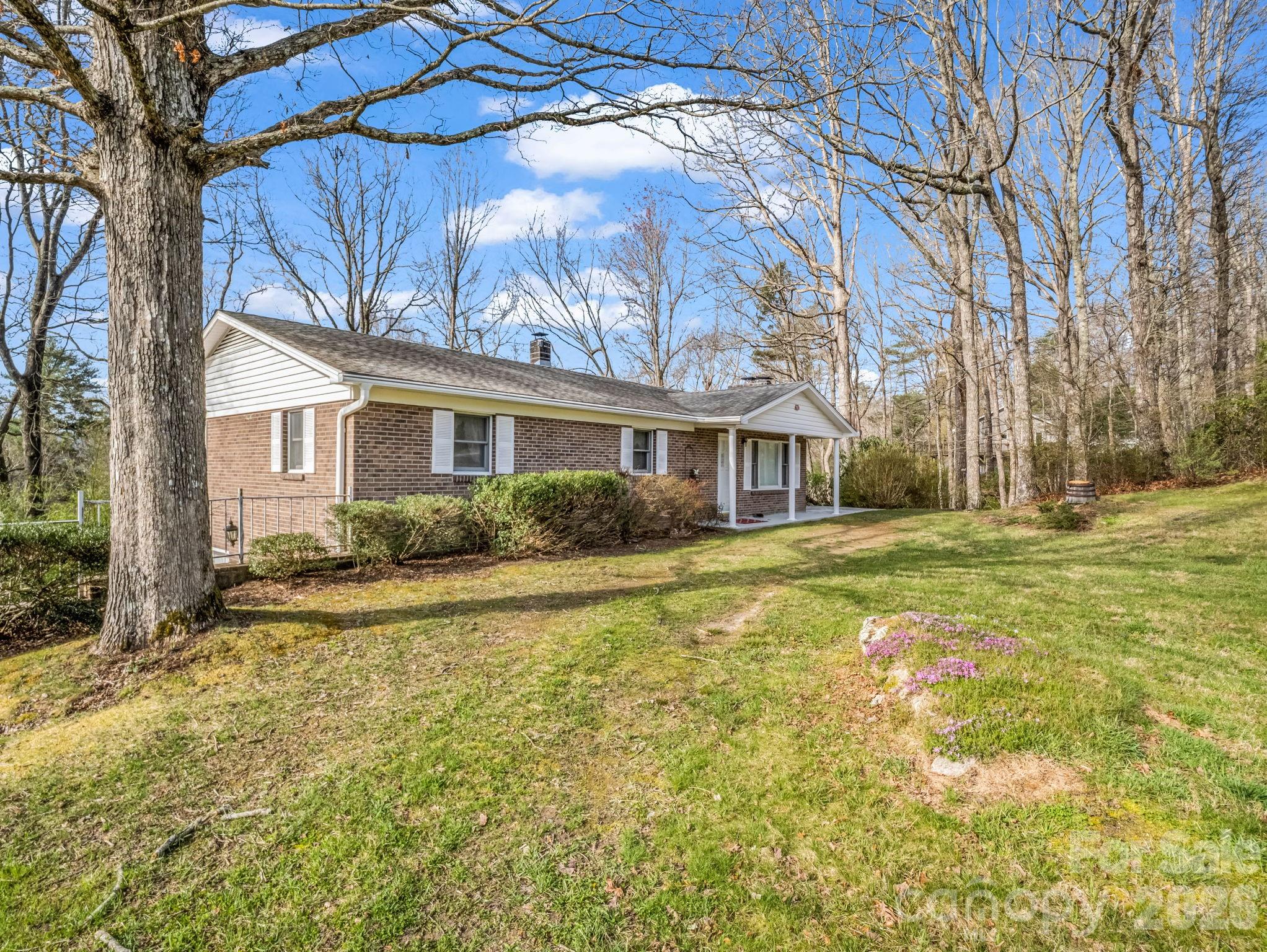 755 Mt Olivet Road Zirconia, NC 28790 - Photo 4 of 35 a front view of a house with a yard