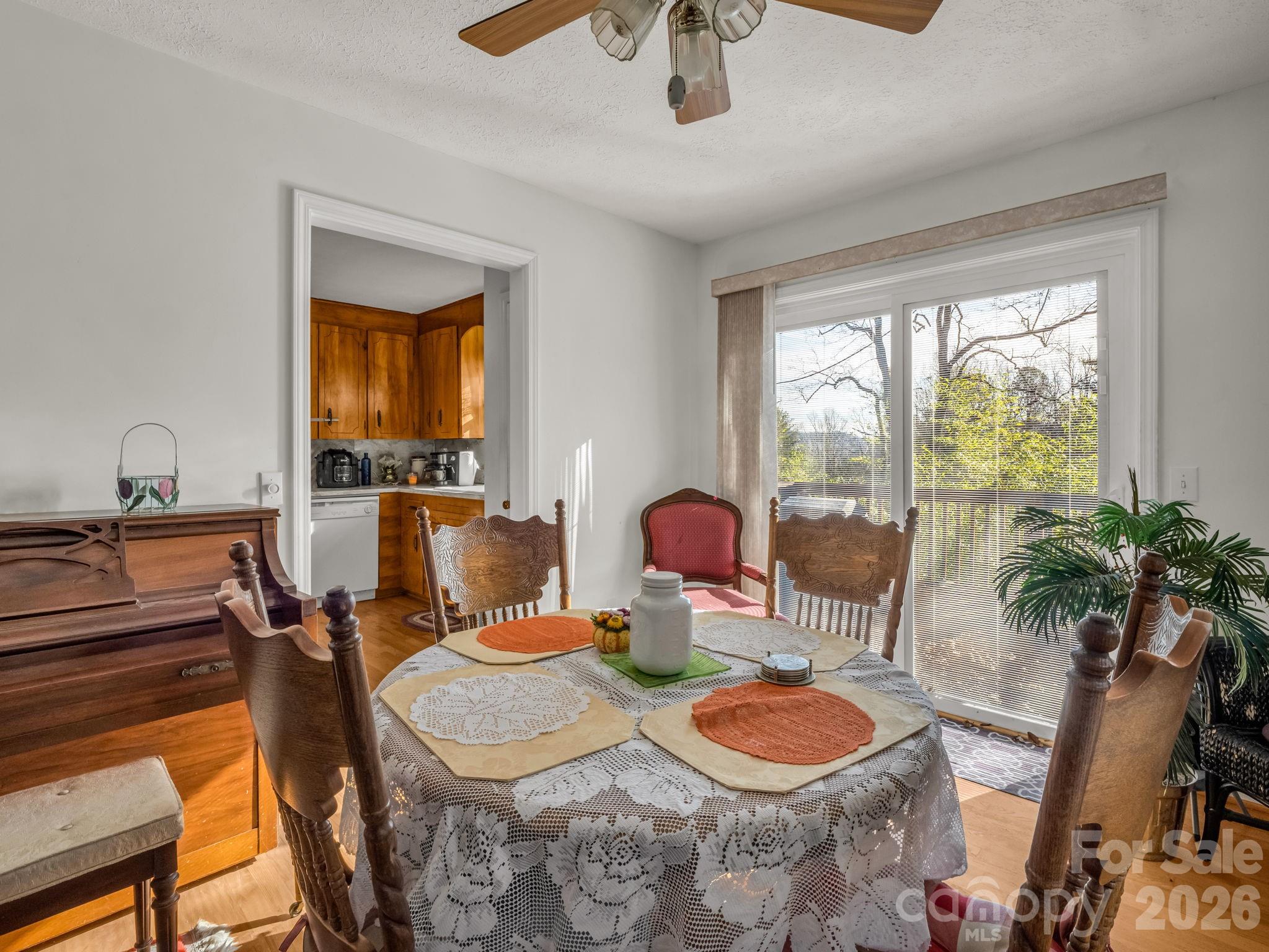 755 Mt Olivet Road Zirconia, NC 28790 - Photo 9 of 35 a dining room with furniture and a window