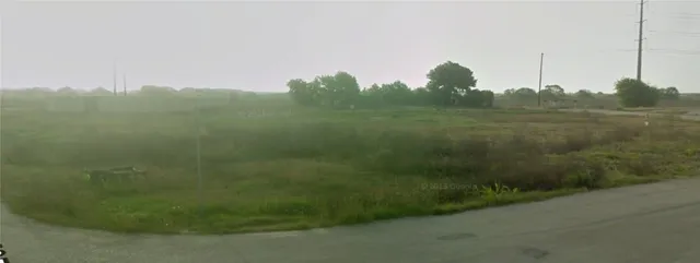 a view of a city with lush green forest