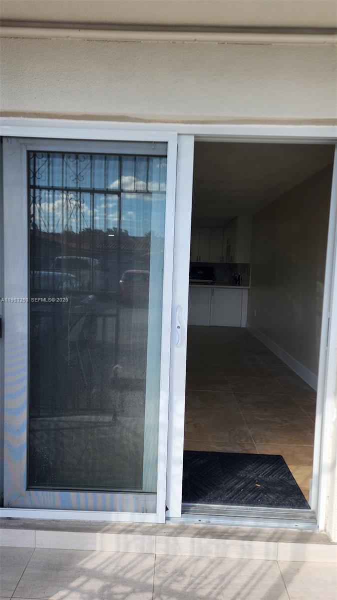 9000 Southwest 24th Street, Unit 14C Miami, FL 33165 - Photo 26 of 27 Secure impact door with lockset.