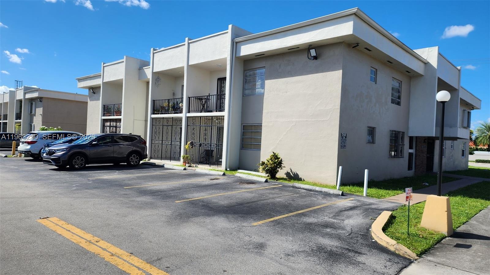 9000 Southwest 24th Street, Unit 14C Miami, FL 33165 - Photo 27 of 27 Parking Lot Entry in Rear of Bldg