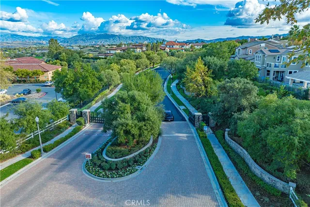 a living room with furniture a fireplace and a table