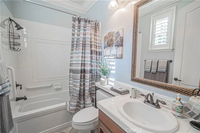 a spacious bathroom with a granite countertop shower a mirror and a shower