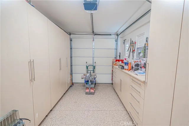 a bathroom with a granite countertop sink mirror vanity and toilet
